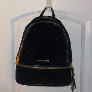 Michael Kors black and gold suede backpack